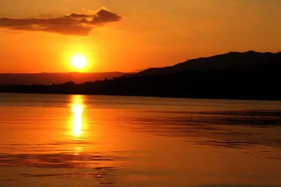 Low res picture of a sunset over islands and the sea