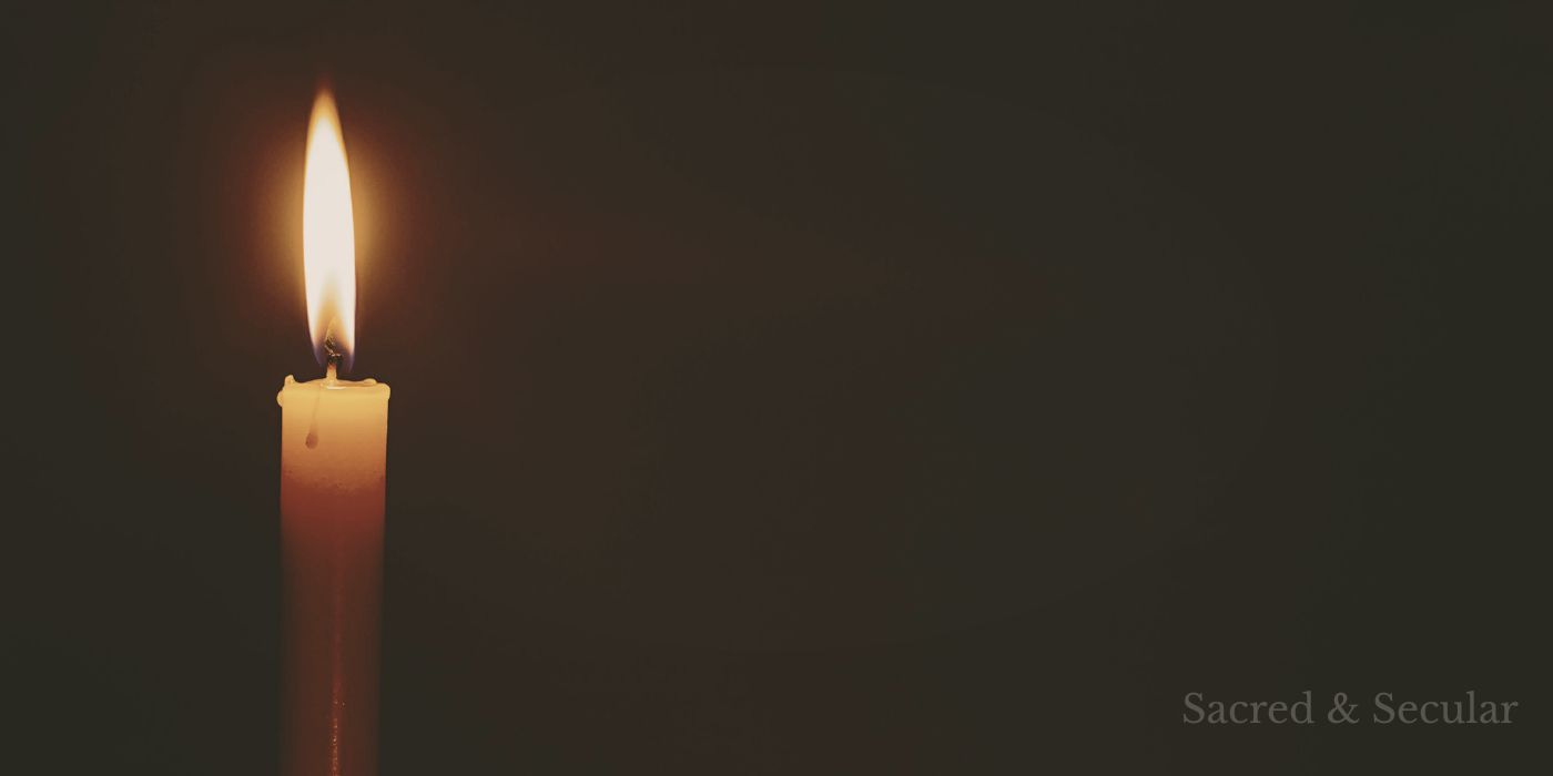A single candle burning in a dark room, casting soft warm light and shadow A single candle burning in a dark room, casting soft warm light and shadow