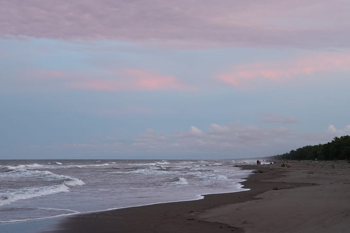 On the left, a wide stretch of calm water taken from one bank and looking to the other side of the canal. Some boats are moored, another is passing. The right hand image is of a sunset beach with white waves crashing on a black sand beach and pink clouds in they sky