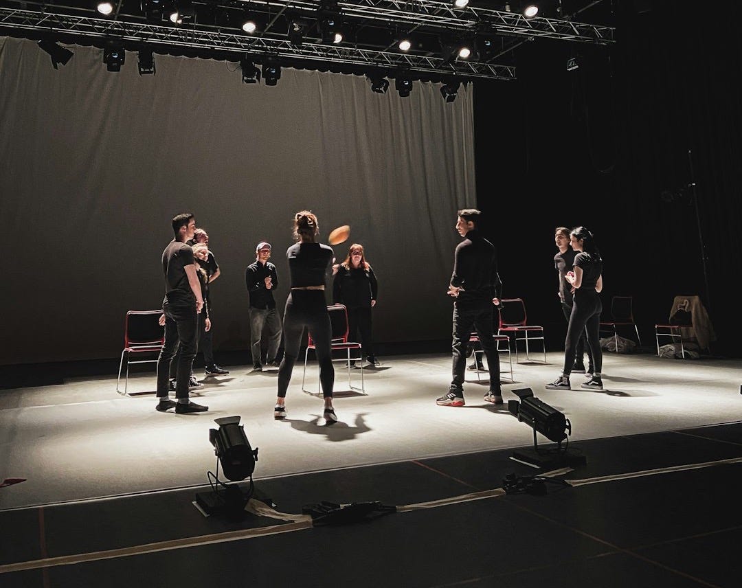 group of people standing on stage group of people standing on stage