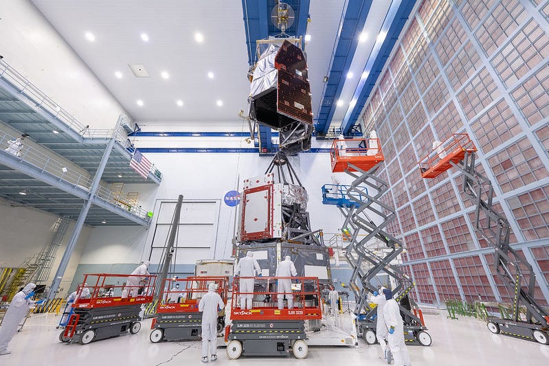 two parts of a space telescope are joined in a NASA clean room