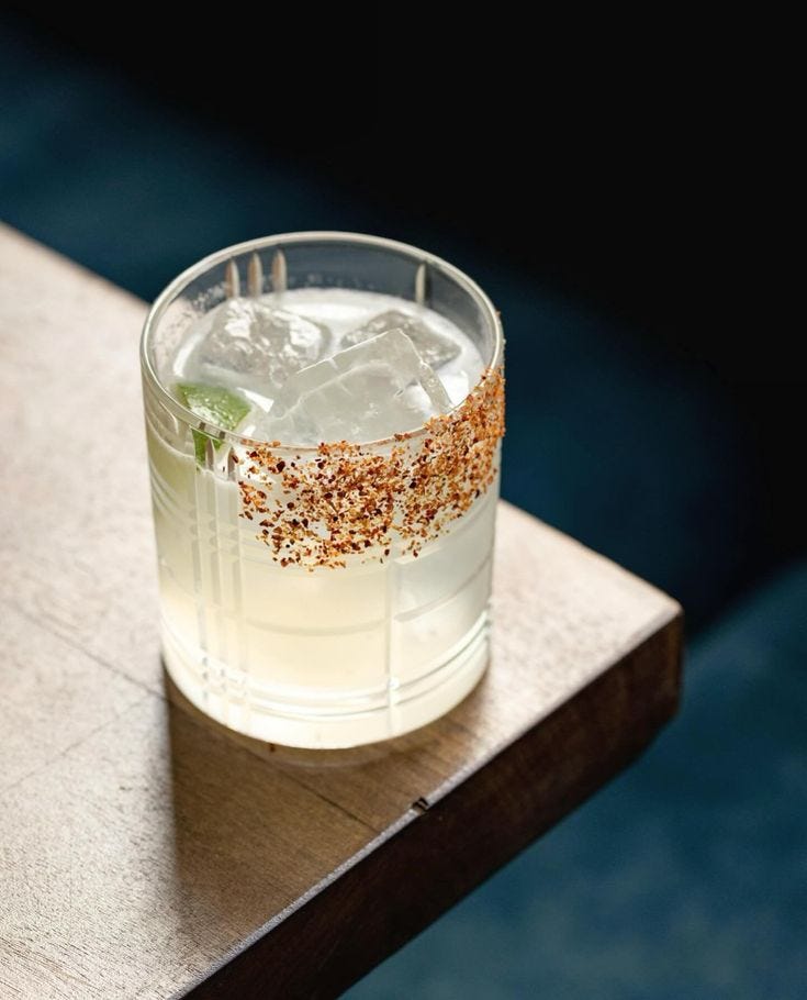 This may contain: a close up of a drink on a table with ice and sprinkles