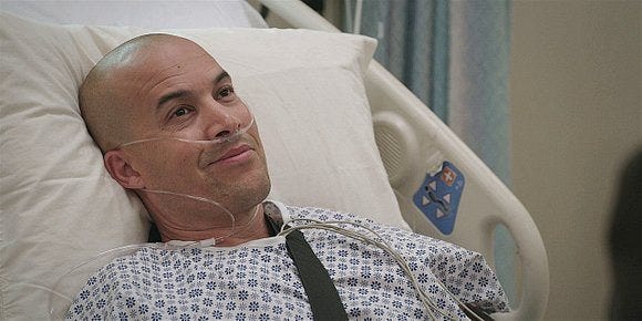 Walker James smiling at Cordell in pain with tubes running in his nose. Walker James smiling at Cordell in pain with tubes running in his nose.