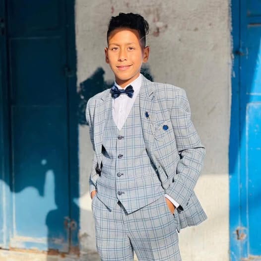 May be an image of 1 person, child and suit