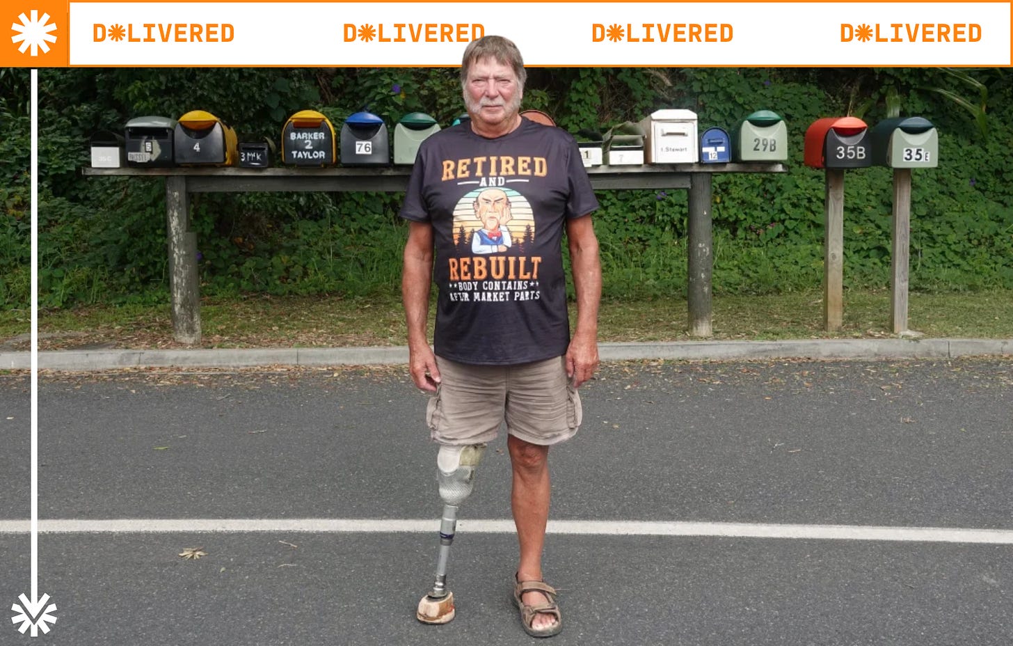 Russel Blank stands staunchly on the road in front of a line of letterboxes. His shirt reads “Retired and Rebuilt. Body contains after market parts”. His right prosthetic leg has a hoof attached to the foot