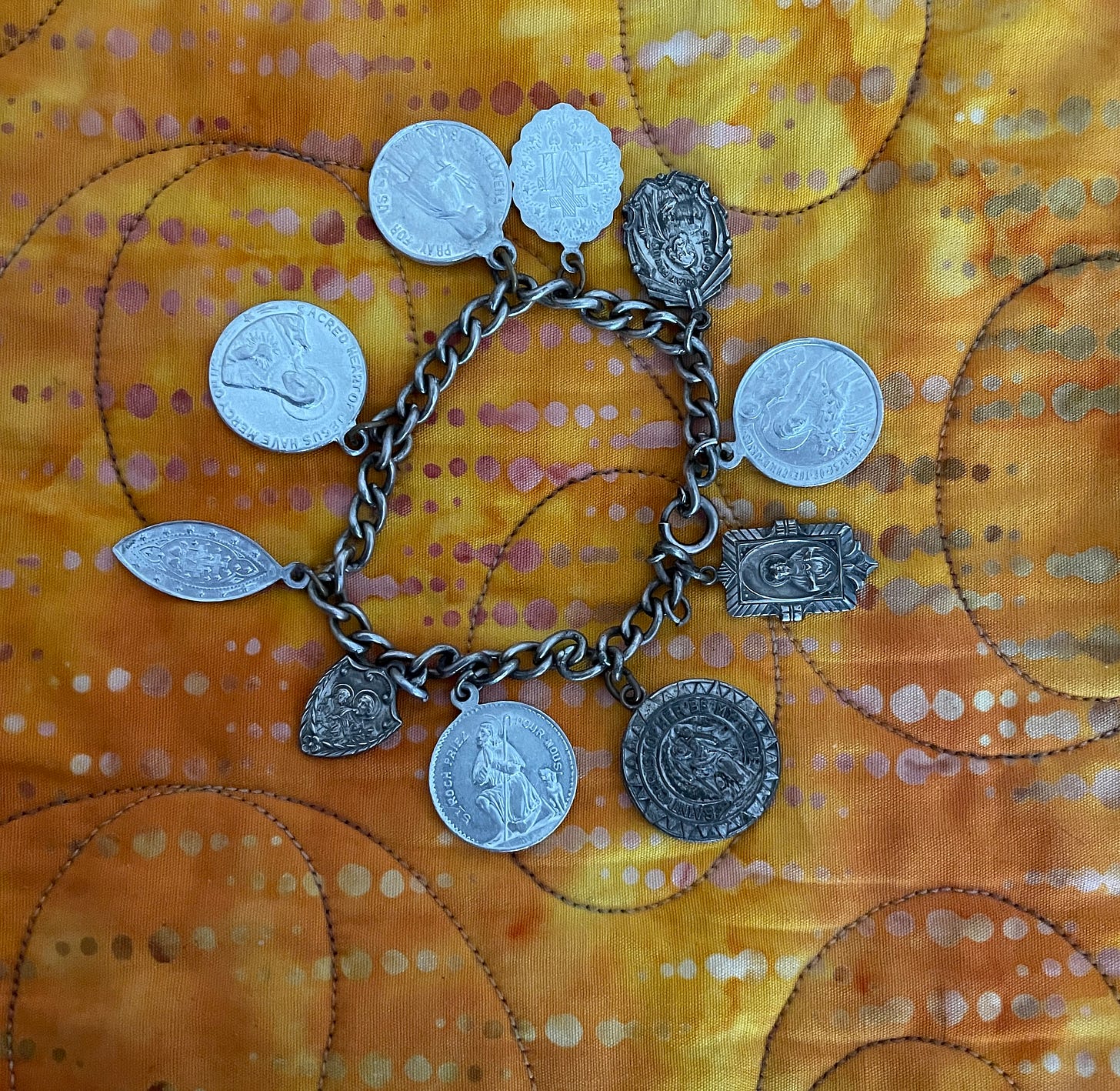 A bracelet made of Catholic medals given to Marlee when she was in an iron lung. 