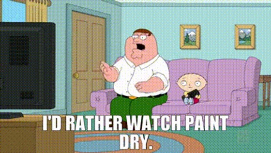 Cartoon man - Family Guy - and child on a purple couch watch TV. Text reads: "I'D RATHER WATCH PAINT DRY." The room has pastel walls and framed art.