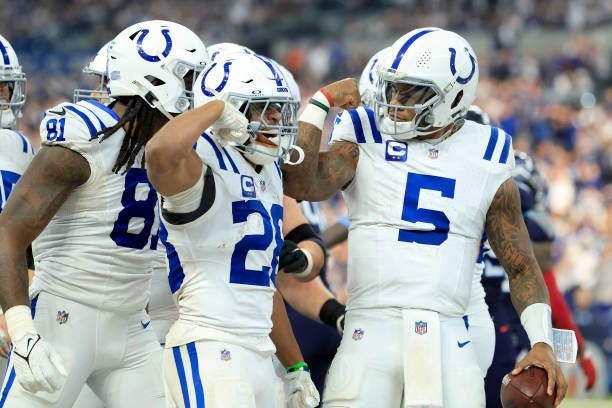 Jonathan Taylor and Anthony Richardson of the Indianapolis Colts celebrate a run in the third quarter while playing the Tennessee Titans at Lucas Oil...