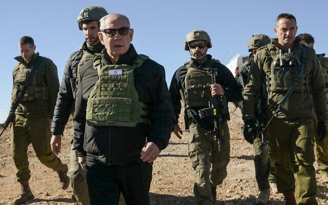 Prime Minister Benjamin Netanyahu visits the top of Mount Hermon on the Syrian Side, along with IDF Chief of Staff Herzi Halevi (right) and other troops, December 17, 2024. (Maayan Toaf/GPO) Prime Minister Benjamin Netanyahu visits the top of Mount Hermon on the Syrian Side, along with IDF Chief of Staff Herzi Halevi (right) and other troops, December 17, 2024. (Maayan Toaf/GPO)