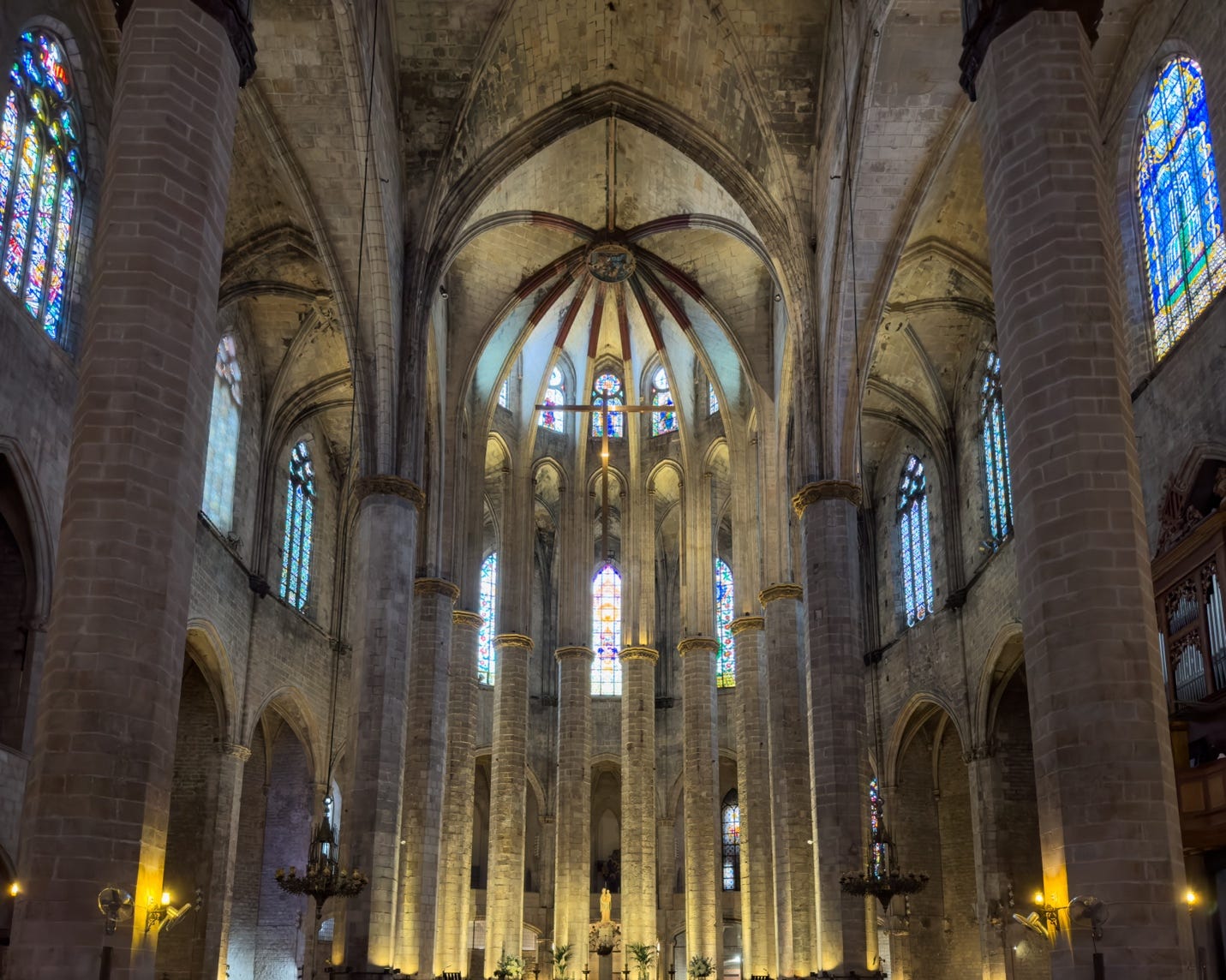 A large stone building with many windows

AI-generated content may be incorrect.