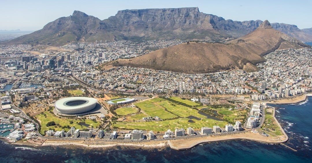 aerial view of city near mountain during daytime