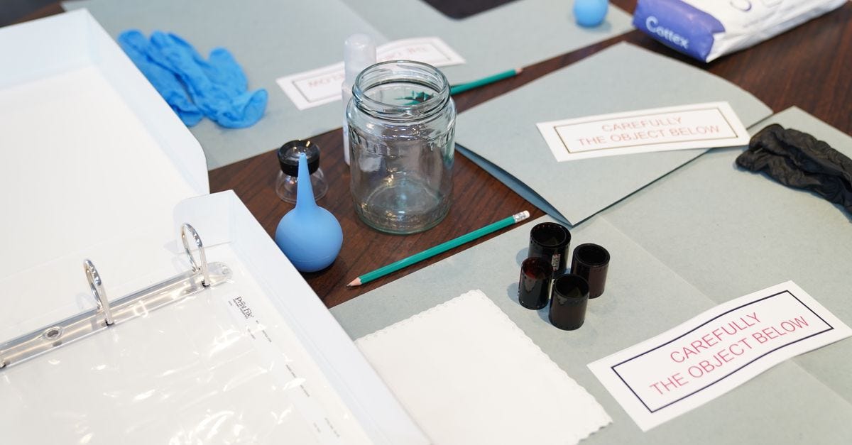 Photo: Tahir Xəlfəquliyev / Pexels Organized forensic tools including gloves and jars on a table for investigation.