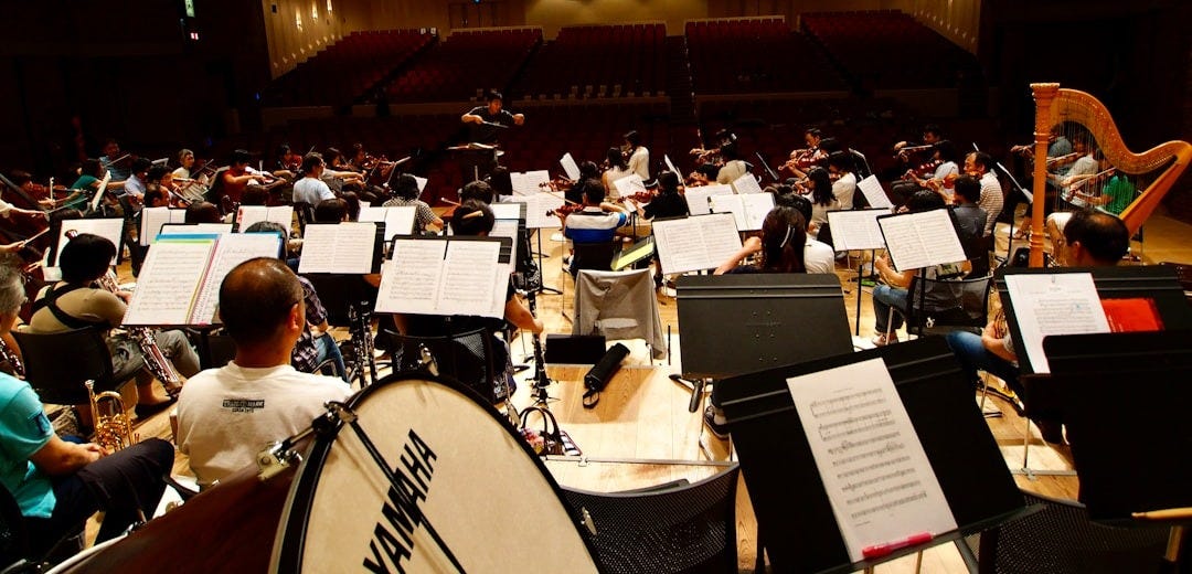 A large orchestra with lots of musical instruments A large orchestra with lots of musical instruments