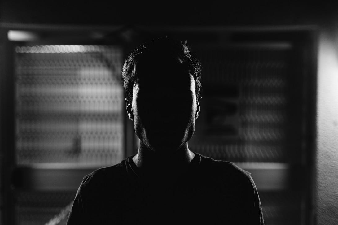 A male face blackened out in the shadows Photo by Malik Earnest on Unsplash A male face blackened out in the shadows Photo by Malik Earnest on Unsplash