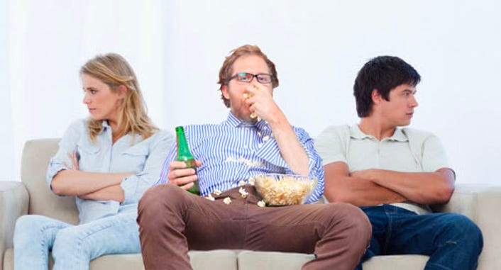 man eating on couch