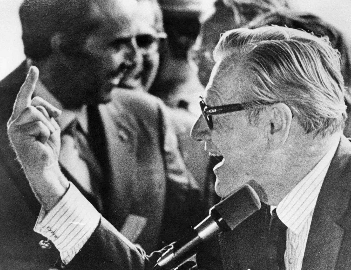 Vice President Nelson Rockefeller flips off a crowd of young hecklers, Binghamton, NY, September 16, 1976. 