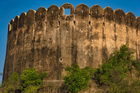 Images of the buildings and ramparts of the Nahargarh Fort in the late afternoon sun.