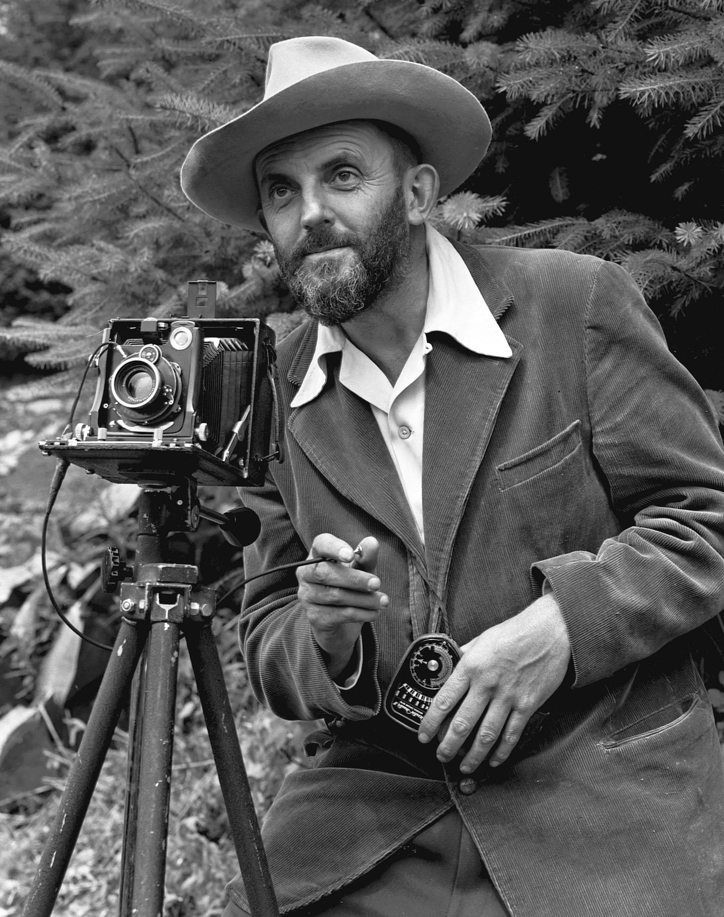 Photographic portrait of nature photographer Ansel Adams — which first appeared in the 1950 Yosemite Field School yearbook. The camera is probably a Zeiss Ikon Universal Juwel. Photographic portrait of nature photographer Ansel Adams — which first appeared in the 1950 Yosemite Field School yearbook. The camera is probably a Zeiss Ikon Universal Juwel.