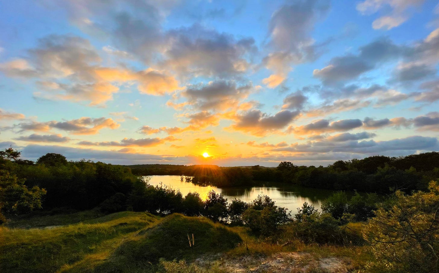 sunset at the heart-shaped lake in Zeeland by Alexander Verbeek for the planet newsletter