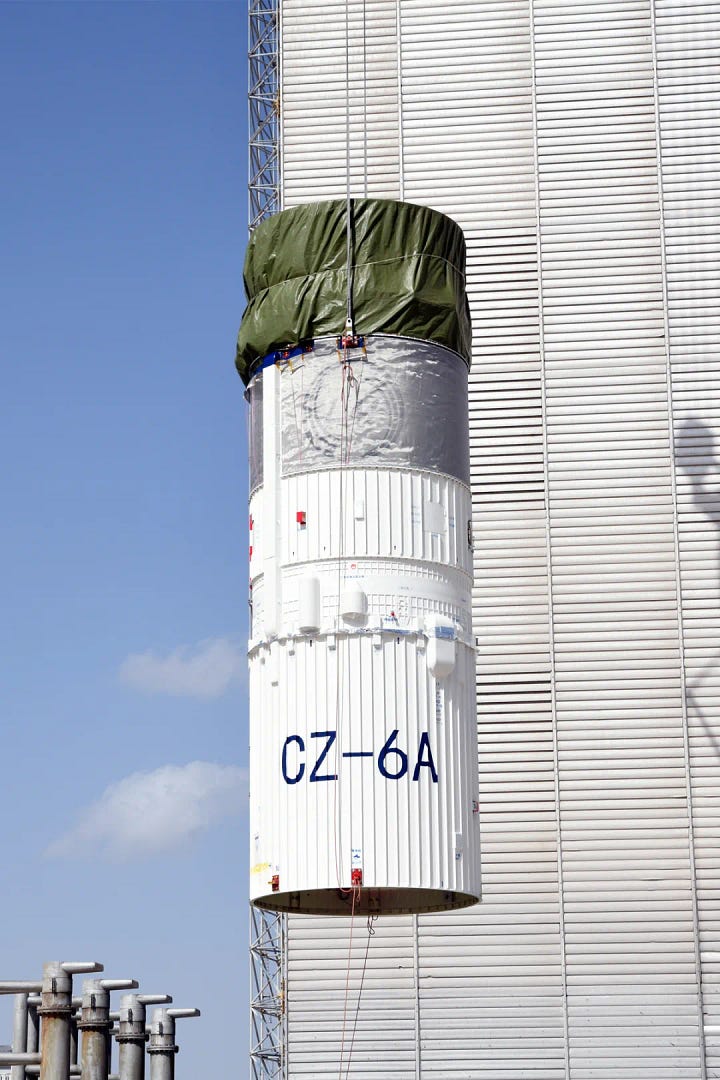 The Long March 6A's fairing and second-stage heading to and being lifted onto Launch Complex 9A.