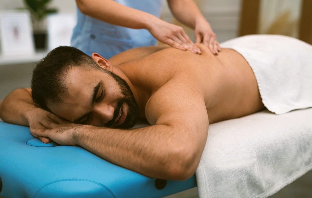 A man being massaged A man being massaged