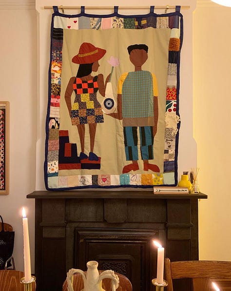 An assortment of textile art and patchwork dresses made by Sarah Nsikak.