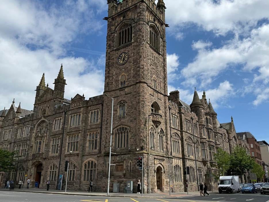 A stone building with a clock tower

AI-generated content may be incorrect.