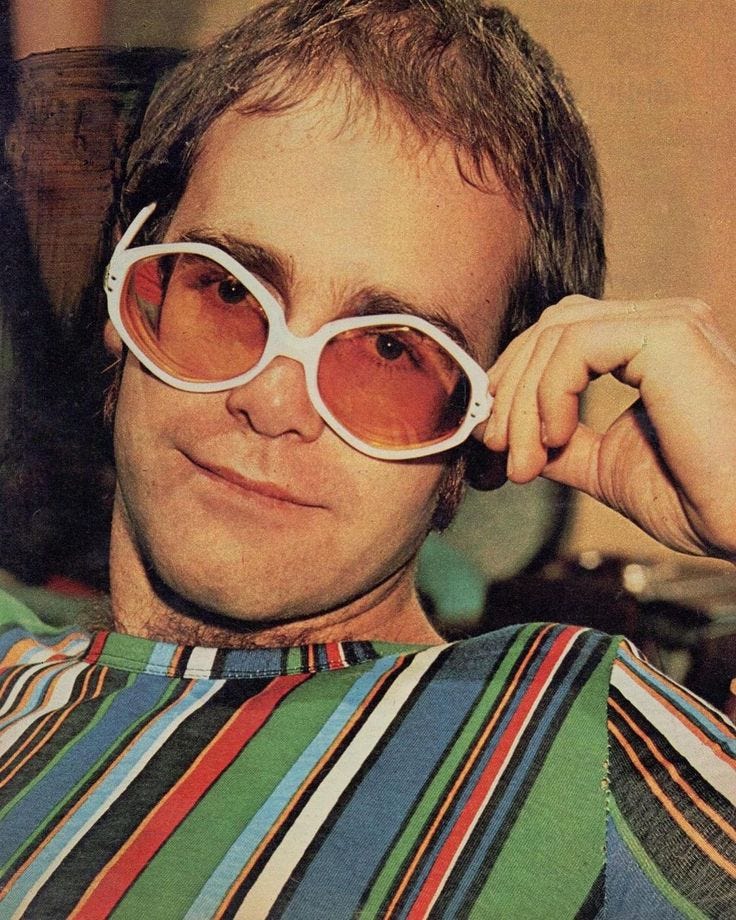 alex on Instagram: “elton in a 1972 jackie pin-up! unfortunately i can't  hear him over his Loud ass shirt #eltonjohn #70s”