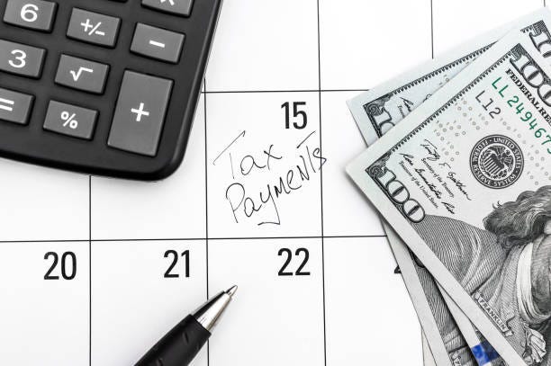 Reminder of tax payment written on calendar. Tax time concept. Reminder of tax payment written on calendar. Tax time concept. quarrterly tax payments stock pictures, royalty-free photos & images