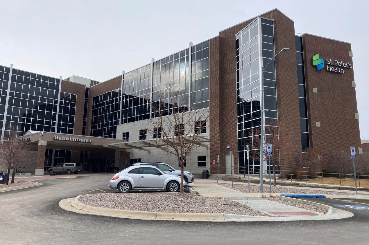 Cars are parked outside the main entrance to St. Peter's Health in Helena, Montana on Dec. 6, 2021. Cars are parked outside the main entrance to St. Peter's Health in Helena, Montana on Dec. 6, 2021.