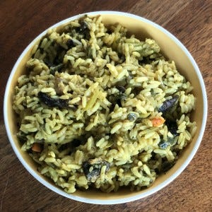 Fiery Nigerian rice and collards from Funmi's Cafe in Louisville.