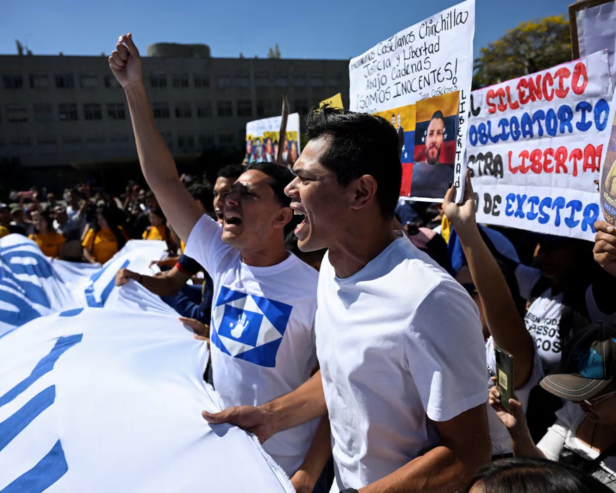 People taking part in a rally to call for the release of political prisoners in Caracas, Venezuela. (Credits: Maxwell Briceno/The Guardian)