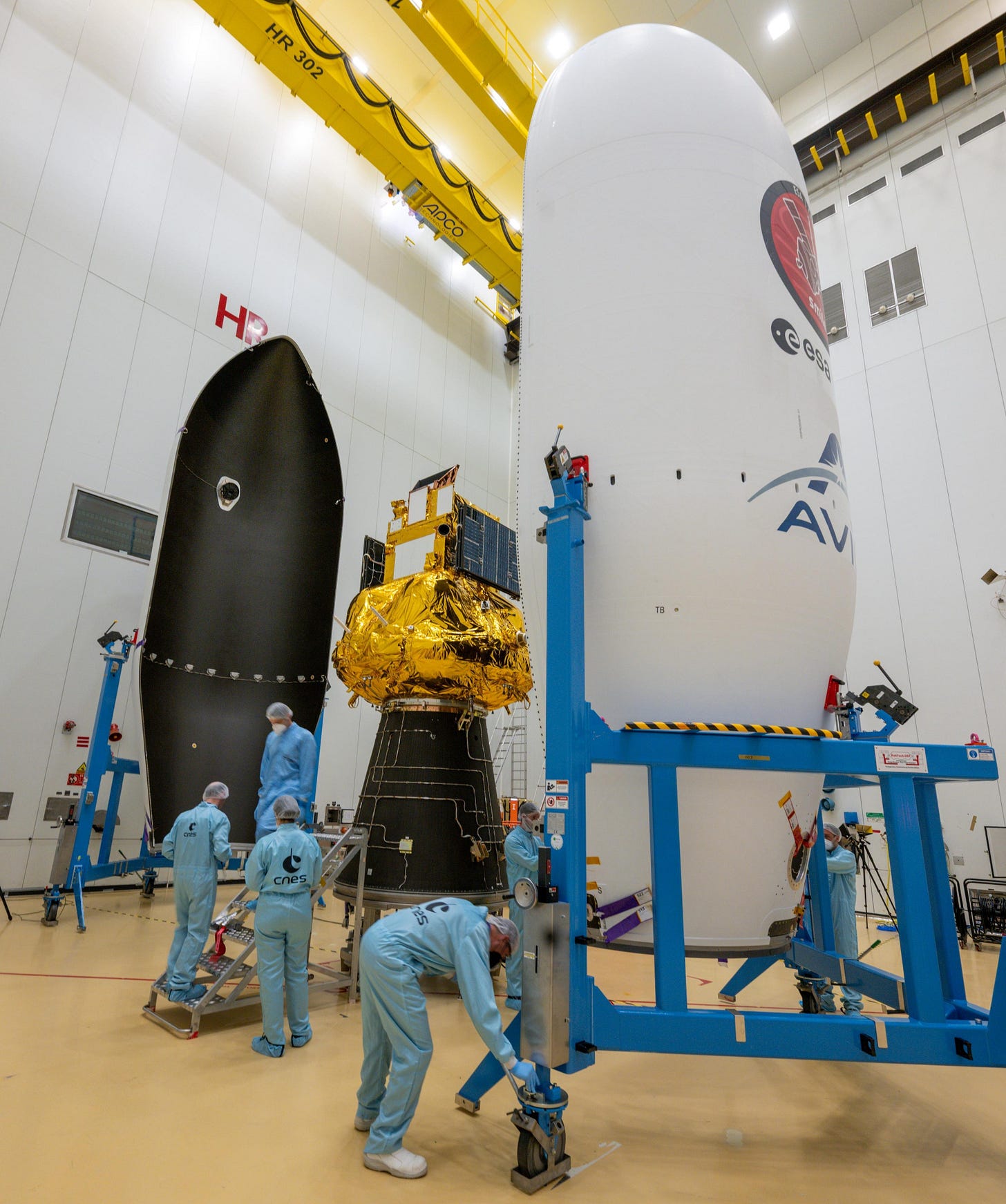 The SMILE spacecraft being encapsulated by Vega-C’s two fairing halves at the end of March 2026. The SMILE spacecraft being encapsulated by Vega-C’s two fairing halves at the end of March 2026.