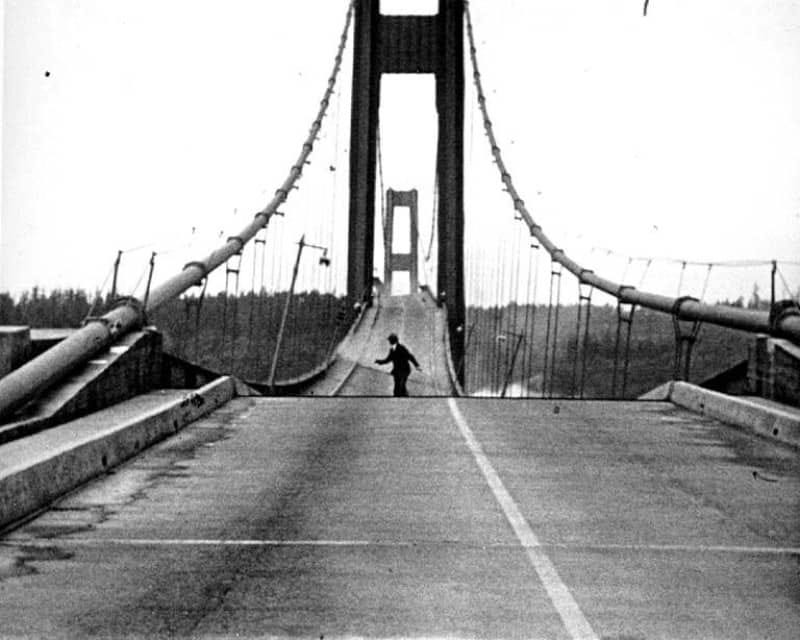 Howard Clifford staggers off the Tacoma Narrows Bridge just before it plunges into Puget Sound, 7 November 1940. Howard Clifford staggers off the Tacoma Narrows Bridge just before it plunges into Puget Sound, 7 November 1940.
