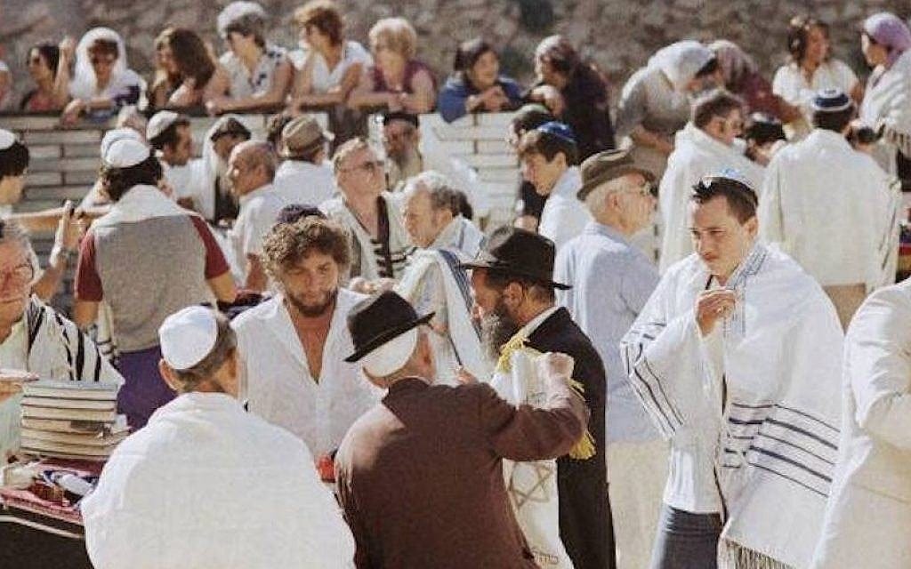 Bob Dylan, third from left, with his son Jesse, in the white tallis on right, at the Western Wall in September 1983. (Facebook)