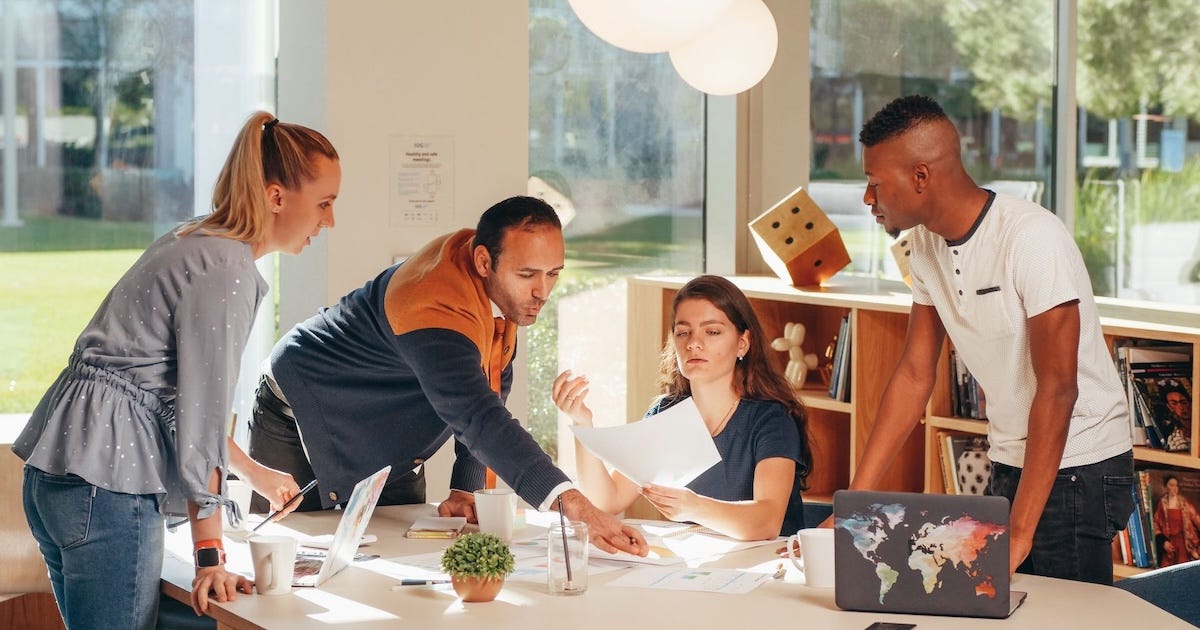 Business leaders strategizing a B2B marketing pivot to drive innovation during uncertain times. Business leaders strategizing a B2B marketing pivot to drive innovation during uncertain times.