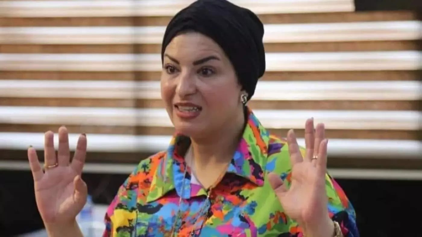 A person with a black head scarf

Description automatically generated