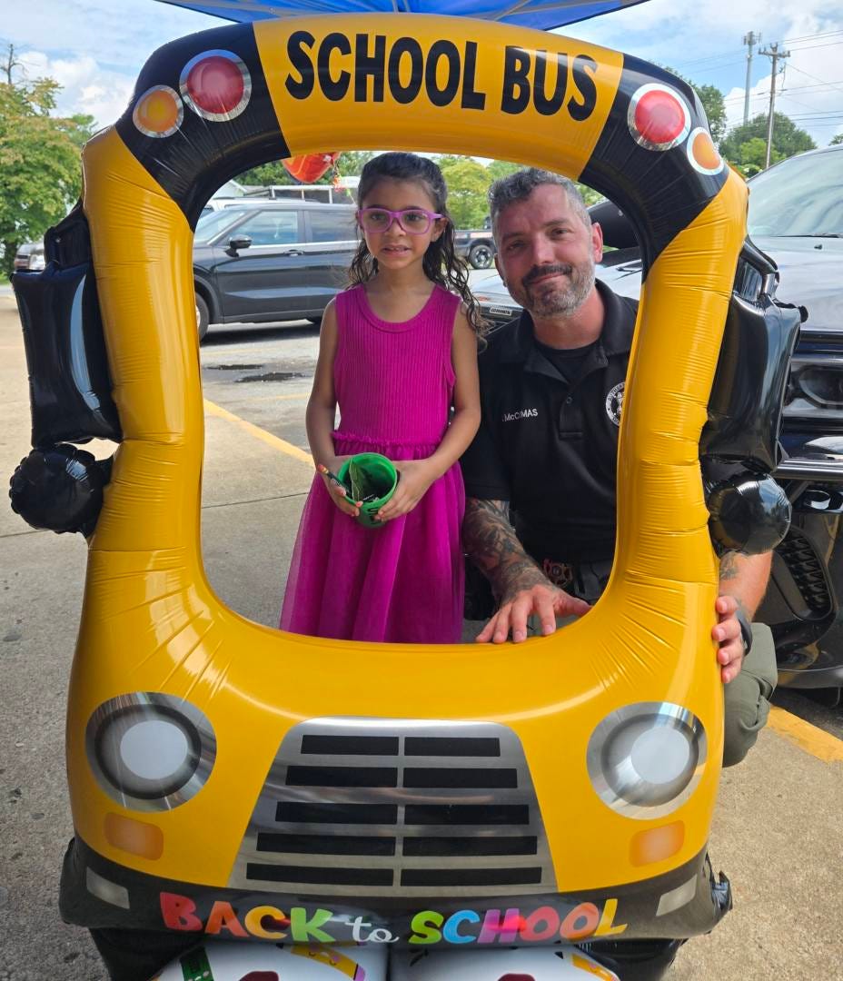 May be an image of 2 people and text that says 'SCHOOL BUS Dc ACKto SC SCHOOL ACKt.SCHOOL HOOL'