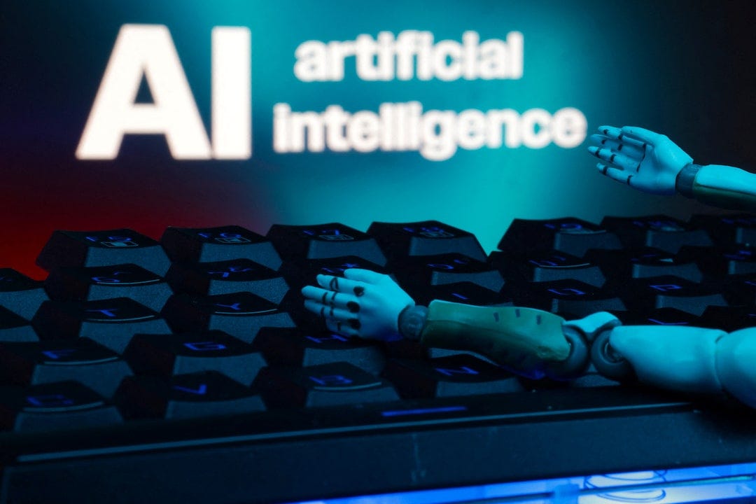 Illustration shows message reading "AI artificial intelligence", keyboard and robot hands