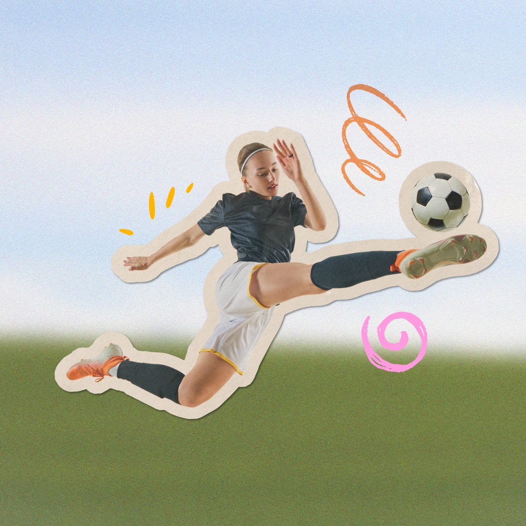A woman kicking a soccer ball
