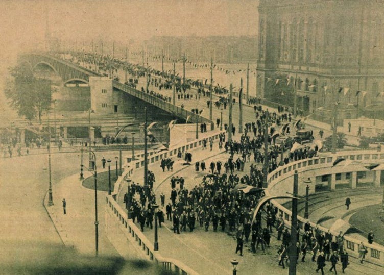 A group of people walking on a bridge

AI-generated content may be incorrect.