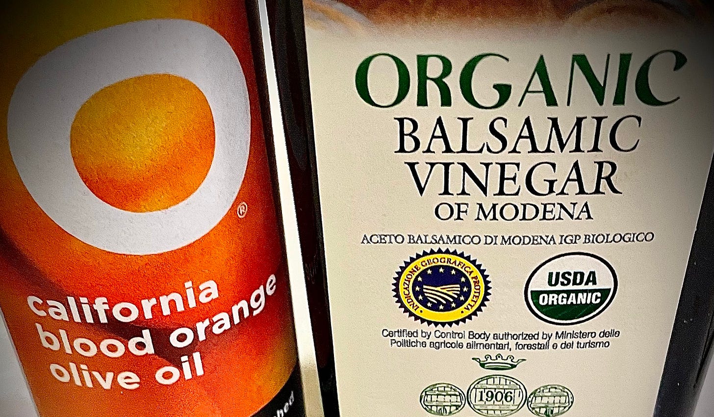 Premium California blood orange olive oil and organic balsamic vinegar of Modena from Acetum, featured ingredients in AthleteMealPrep.com’s signature vinaigrette recipes, ideal for high-flavor salad prep.
