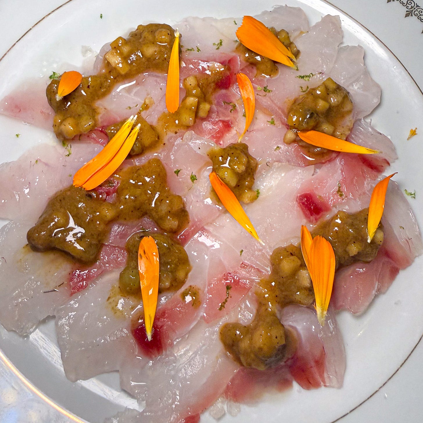 Pagre crudo with apple-kiwi salsa verde and marigold petals at Petit Vatel, Paris 6th Pagre crudo with apple-kiwi salsa verde and marigold petals at Petit Vatel, Paris 6th