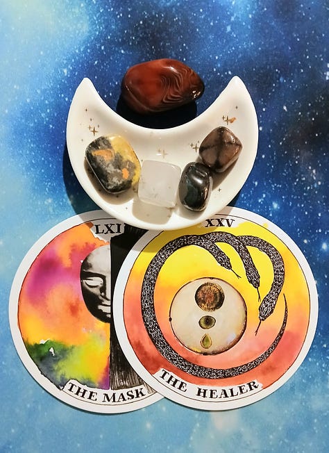 Wild Unknown Archetype cards, (The Mask, & The Healer) and crystals on a starry blue background