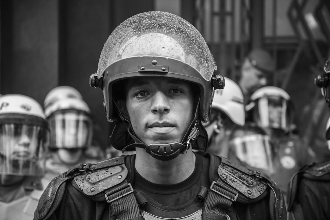 Free Close-up grayscale portrait of a riot police officer in Sao Paulo, Brazil. Stock Photo Free Close-up grayscale portrait of a riot police officer in Sao Paulo, Brazil. Stock Photo