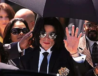 Michael Jackson amid a throng of people