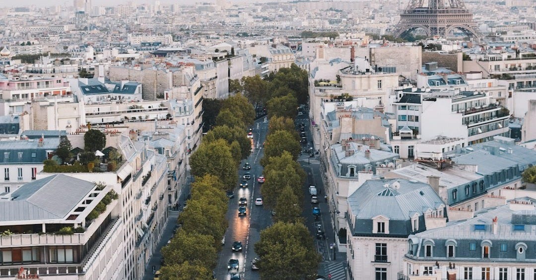 busy street near Eiffel Tower in Paris during daytime