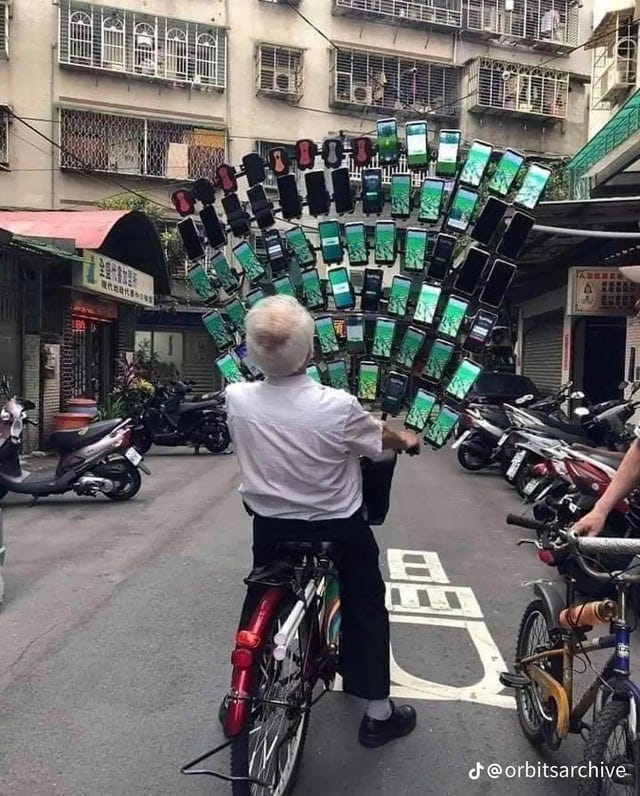 Saw and wanted to share 😊- 74 yo man plays Pokémon Go on 64 phones rigged  to his bike. Chen San-Yuan, a Taiwanese grandfather, was introduced to the  game in 2016 by