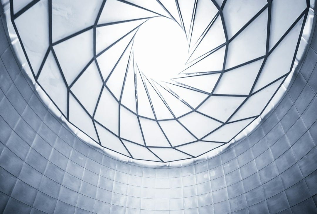 woman wearing black shirt facing the ceiling