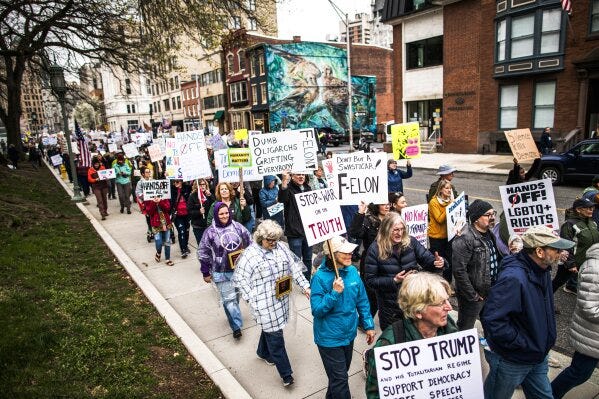 Demonstrators hold a rally at the Pennsylvania state capitol in Harrisburg, Pa., during the "Hands Off!" national day of protest against the Trump Administration on Saturday, April 5, 2025. (Zach Gleiter/The Patriot-News via AP)